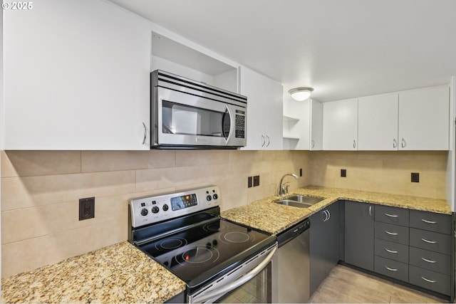 668 Mcvey Ave Unit 83, Lake Oswego, OR 97034 - kitchen with stainless steel appliances, open shelves, white cabinetry, and tasteful backsplash