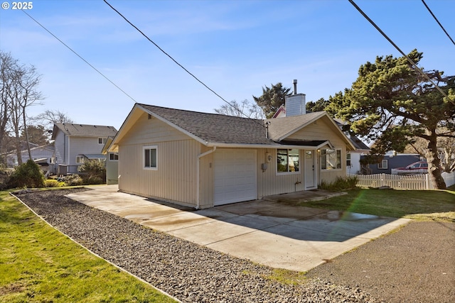 bungalow with a garage and a front lawn