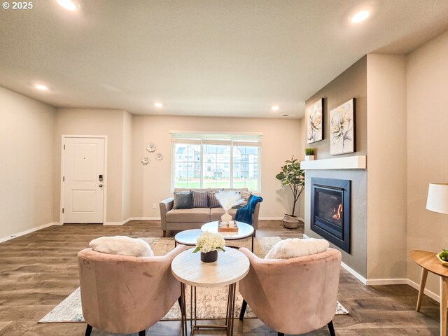 16156 NW Pristine Ln, Portland, OR 97229 - living area with recessed lighting, wood finished floors, a glass covered fireplace, and baseboards