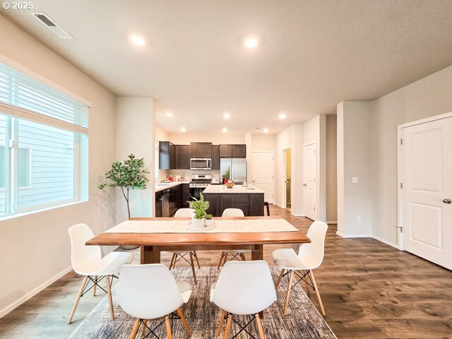 16156 NW Pristine Ln, Portland, OR 97229 - dining area with wood finished floors, baseboards, and recessed lighting