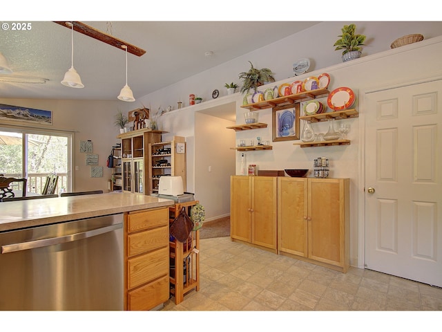 kitchen with pendant lighting, open shelves, dishwasher, light countertops, and light floors