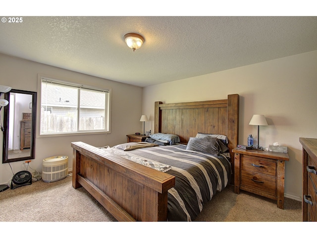 bedroom with baseboards and light carpet
