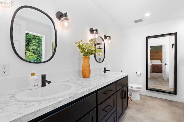 28009 NE Thompson Cir, Yacolt, WA 98675 - ensuite bathroom featuring double vanity, vaulted ceiling, and recessed lighting