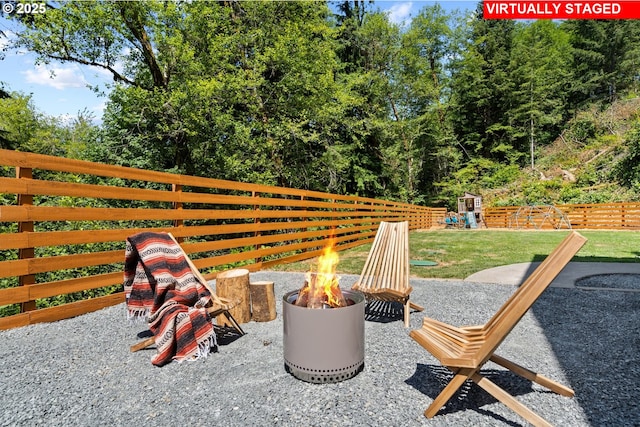 28009 NE Thompson Cir, Yacolt, WA 98675 - view of patio featuring an outdoor fire pit