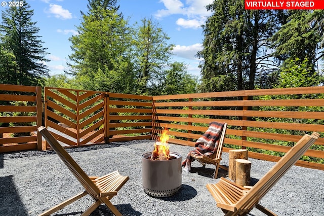 28009 NE Thompson Cir, Yacolt, WA 98675 - view of patio / terrace featuring an outdoor fire pit