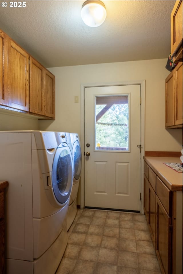 62482 Canyon Creek Ln, Canyon City, OR 97820 - laundry area featuring cabinet space, separate washer and dryer, and a textured ceiling