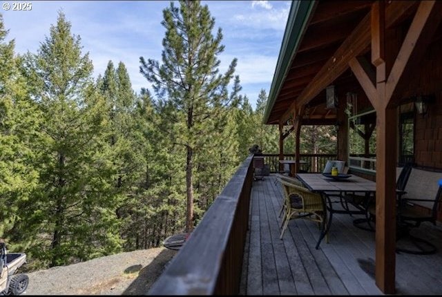 62482 Canyon Creek Ln, Canyon City, OR 97820 - deck with outdoor dining area and a forest view