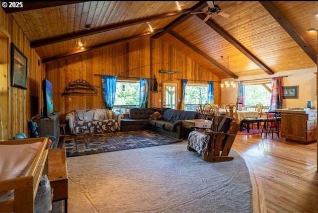 62482 Canyon Creek Ln, Canyon City, OR 97820 - living area featuring wood ceiling, wood walls, wood finished floors, ceiling fan, and a chandelier
