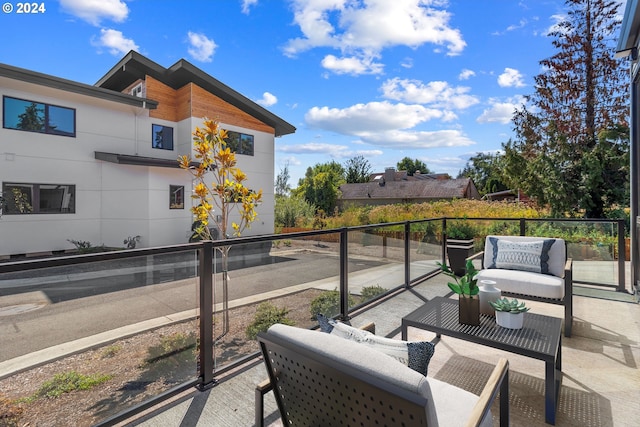 balcony with a patio area and outdoor lounge area