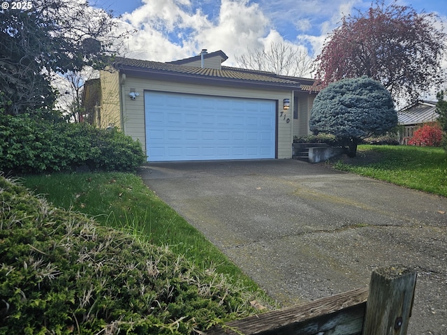 710 E Quince Ave, Hermiston, OR 97838 - view of property exterior featuring a chimney and driveway