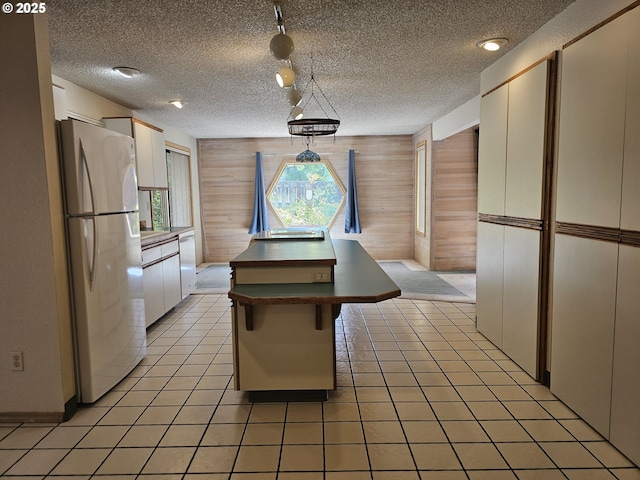 710 E Quince Ave, Hermiston, OR 97838 - kitchen with white appliances, dark countertops, white cabinets, and a sink