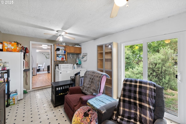 3712 NE 60th Ave, Vancouver, WA 98661 - sitting room with ceiling fan, light flooring, washing machine and clothes dryer, and a textured ceiling
