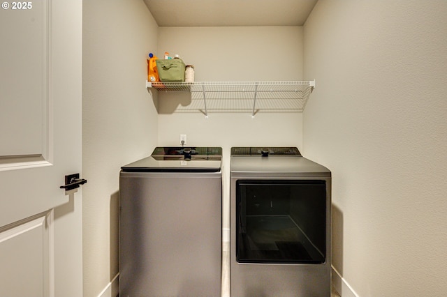 laundry room featuring washer and clothes dryer and laundry area