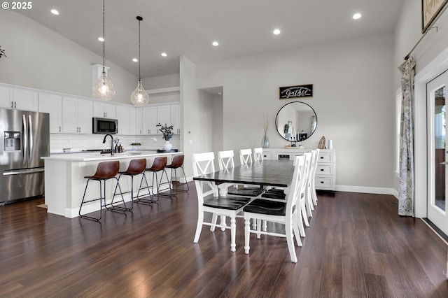 703 Holbrook Ln, Creswell, OR 97426 - dining space with a high ceiling, dark wood-style flooring, baseboards, and recessed lighting