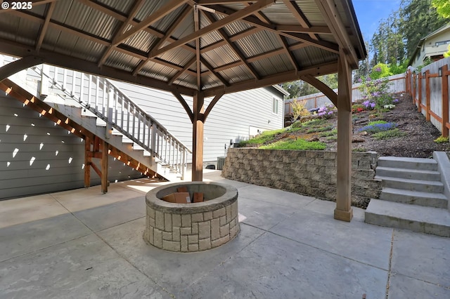 703 Holbrook Ln, Creswell, OR 97426 - view of patio with an outdoor fire pit, stairs, fence, and a gazebo