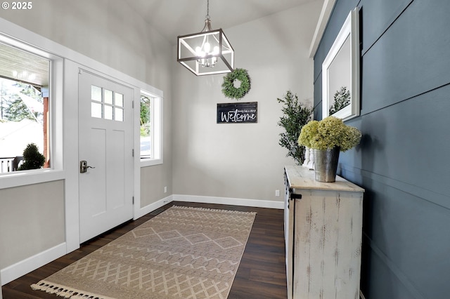 703 Holbrook Ln, Creswell, OR 97426 - foyer featuring a chandelier, dark wood-style flooring, and baseboards