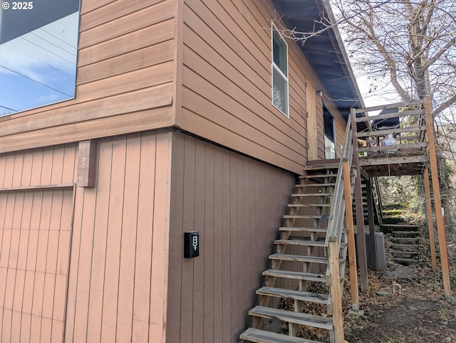 view of side of home with stairway