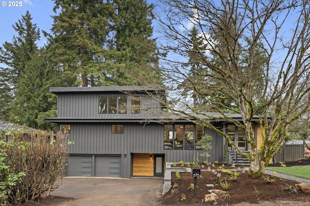 view of front of house featuring an attached garage and driveway