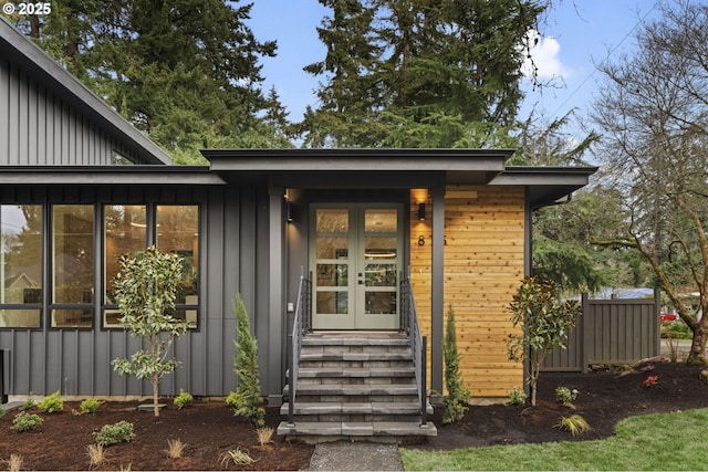 entrance to property with french doors and board and batten siding