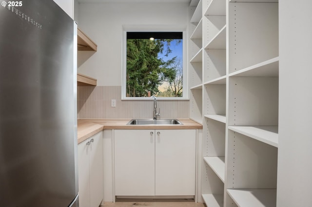 pantry featuring a sink