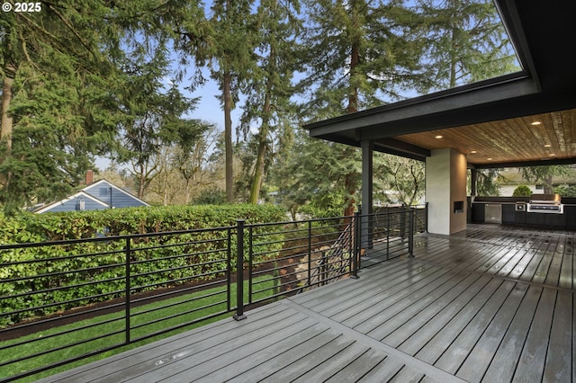 wooden deck featuring exterior kitchen