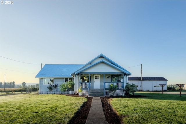 8668 Stayton Rd SE, Turner, OR 97392 - bungalow featuring covered porch, a front yard, and metal roof