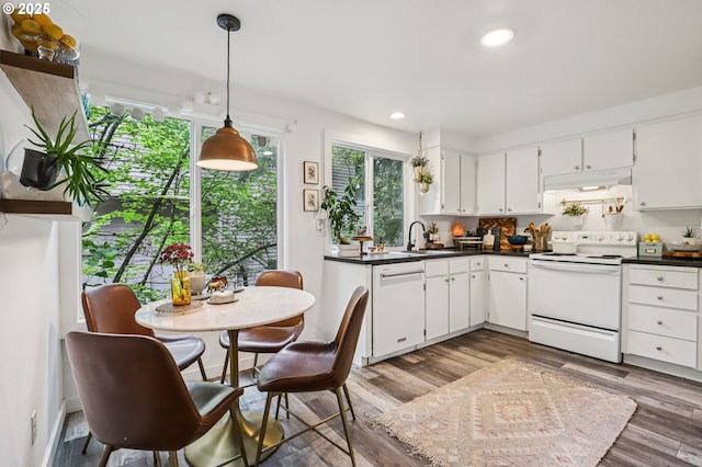 243 Cervantes, Lake Oswego, OR 97035 - kitchen featuring white appliances, dark countertops, wood finished floors, a sink, and recessed lighting