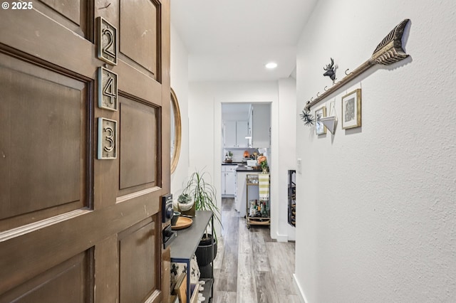 243 Cervantes, Lake Oswego, OR 97035 - corridor featuring light wood-type flooring, recessed lighting, and a textured wall