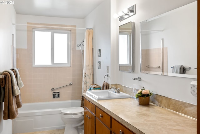 bathroom featuring shower / bath combo with shower curtain, vanity, and toilet