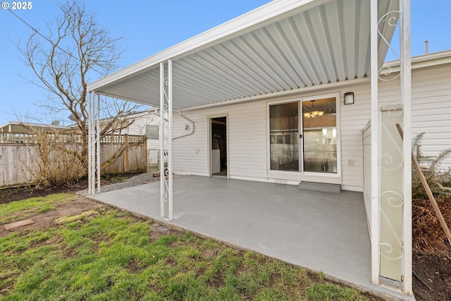 view of patio featuring fence