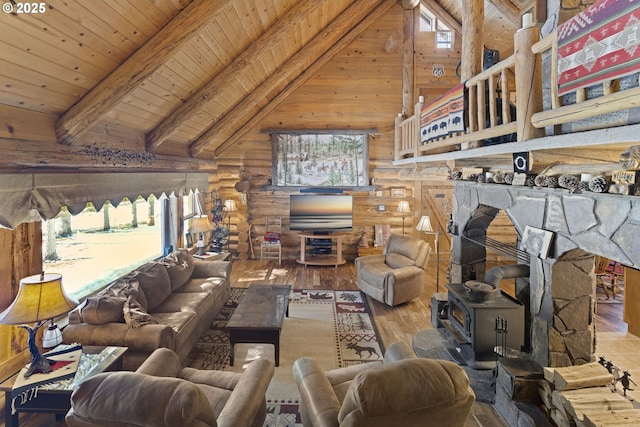 living room with wooden ceiling, log walls, beam ceiling, and wood finished floors