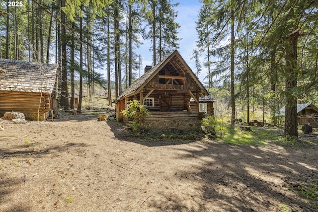 view of side of home with log exterior