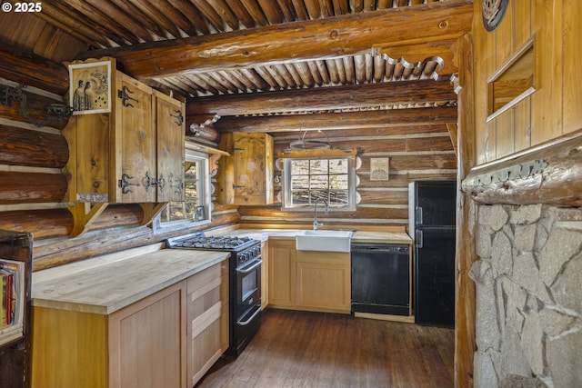 kitchen featuring black appliances, beam ceiling, a sink, light countertops, and dark wood finished floors