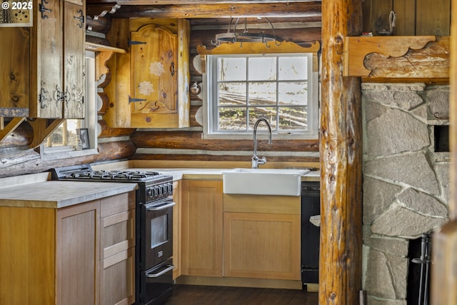 kitchen featuring black appliances, a sink, log walls, light countertops, and dark wood finished floors