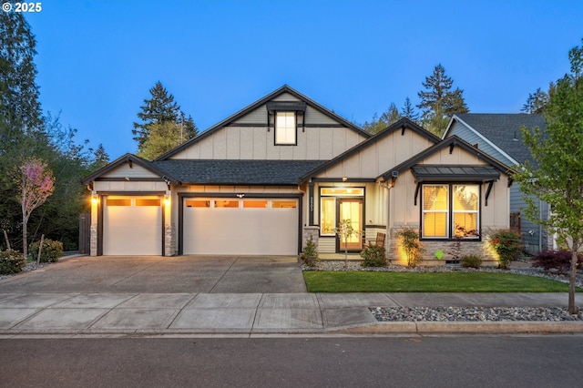 craftsman-style home featuring a shingled roof, concrete driveway, an attached garage, board and batten siding, and stone siding