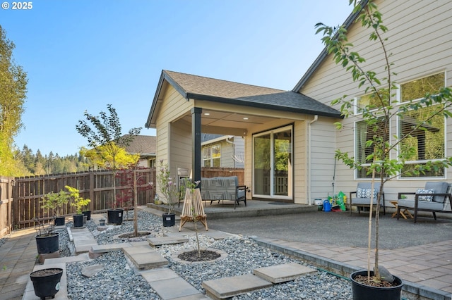 view of patio / terrace with fence and an outdoor living space