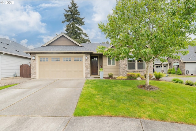 11201 NE 127th Ave, Vancouver, WA 98682 - view of front of home with an attached garage, stone siding, driveway, a front lawn, and a shingled roof