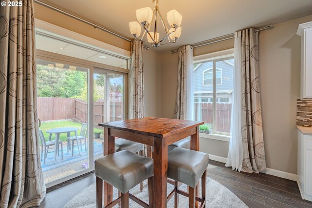 11201 NE 127th Ave, Vancouver, WA 98682 - dining space featuring a chandelier, healthy amount of natural light, and baseboards