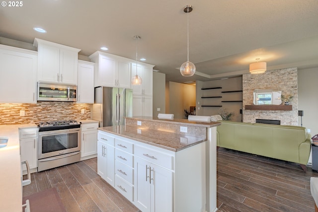 11201 NE 127th Ave, Vancouver, WA 98682 - kitchen with stainless steel appliances, dark wood-type flooring, tasteful backsplash, white cabinets, and recessed lighting