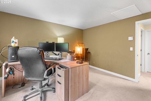office with light colored carpet, attic access, and baseboards