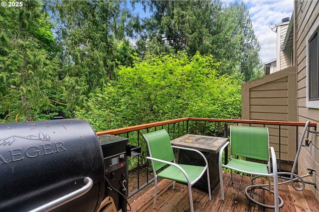 wooden terrace with area for grilling