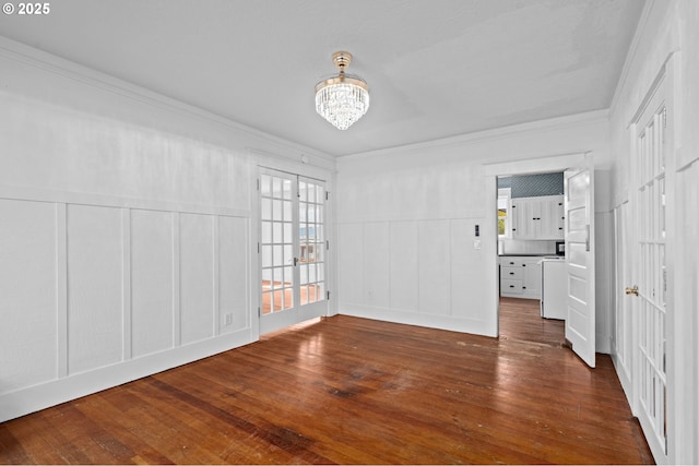 322 W C St, Rainier, OR 97048 - unfurnished bedroom with a decorative wall, ornamental molding, a chandelier, wood-type flooring, and a wainscoted wall