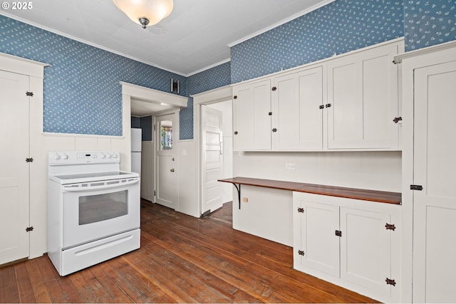 322 W C St, Rainier, OR 97048 - kitchen featuring white electric range, wallpapered walls, ornamental molding, dark wood-style floors, and white cabinetry