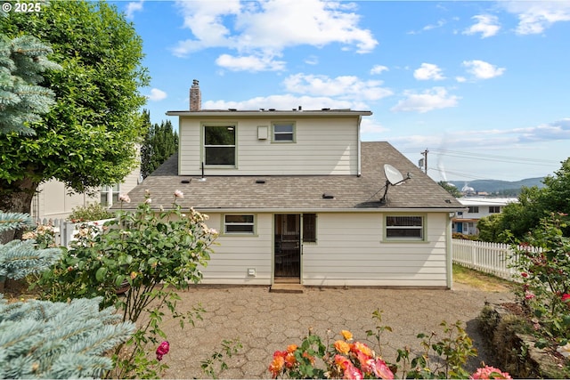 322 W C St, Rainier, OR 97048 - rear view of house with a chimney and a shingled roof