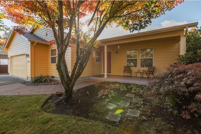 single story home with crawl space, an attached garage, and concrete driveway