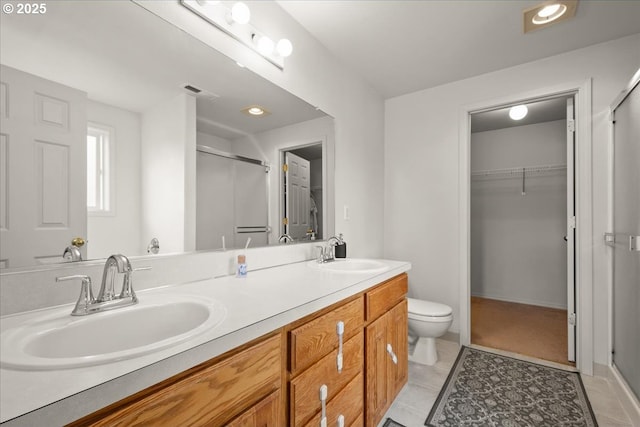 11716 NE 42nd Ct, Vancouver, WA 98686 - bathroom with a shower stall, a spacious closet, and double vanity