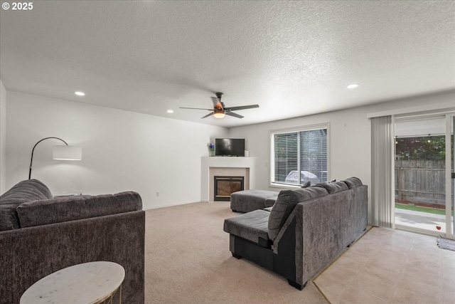 11716 NE 42nd Ct, Vancouver, WA 98686 - living area with plenty of natural light, ceiling fan, a glass covered fireplace, a textured ceiling, and recessed lighting