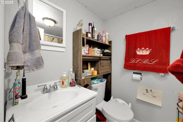 full bath with vanity and toilet