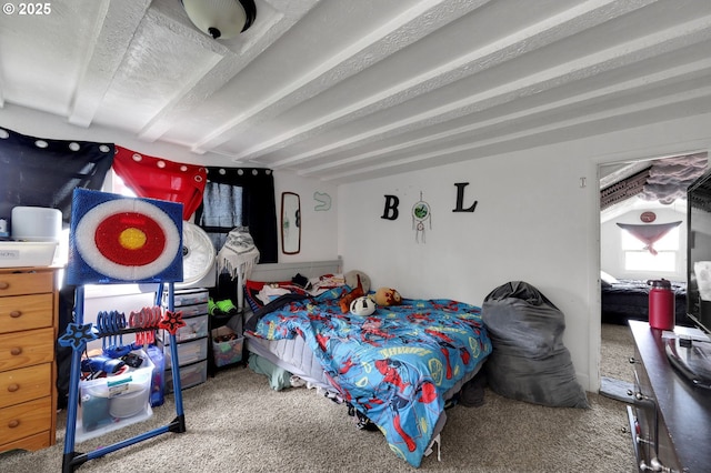 carpeted bedroom featuring beam ceiling