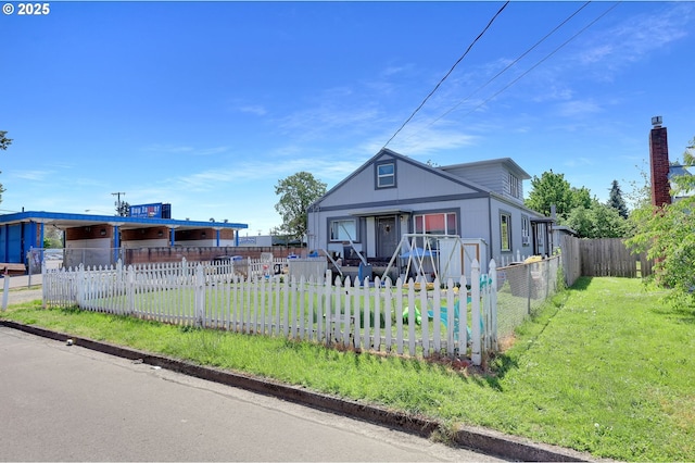 bungalow with covered porch, a fenced front yard, and a front yard